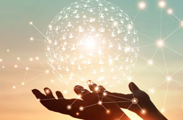 Composited graphic of two hands holding a ball with interconnected people icons.
