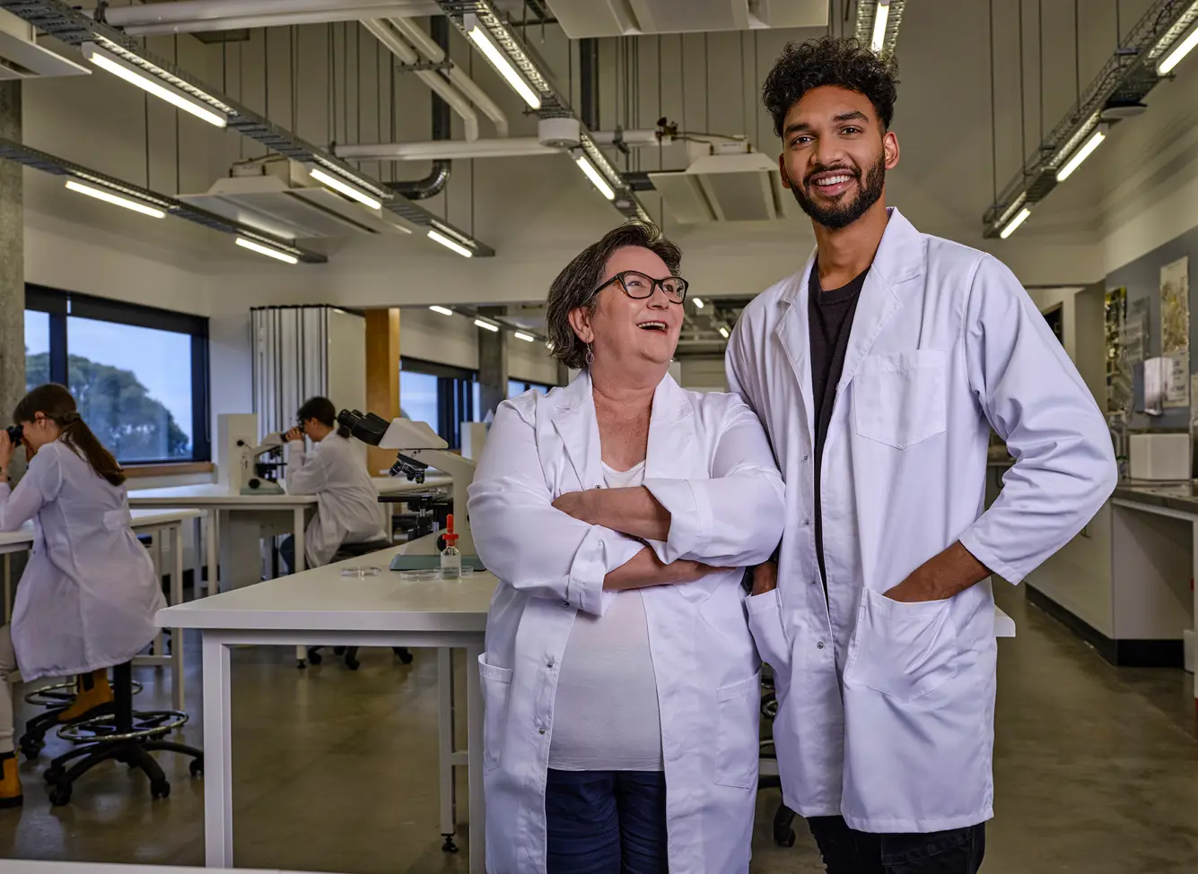 Photo of two researchers in a lab setting.