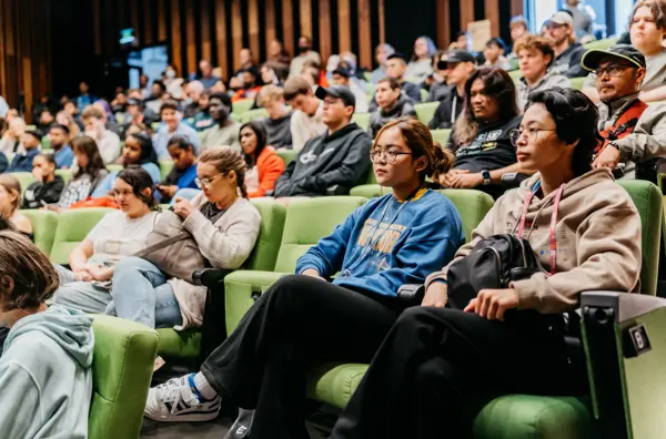 Photo of an auditorium full of students.