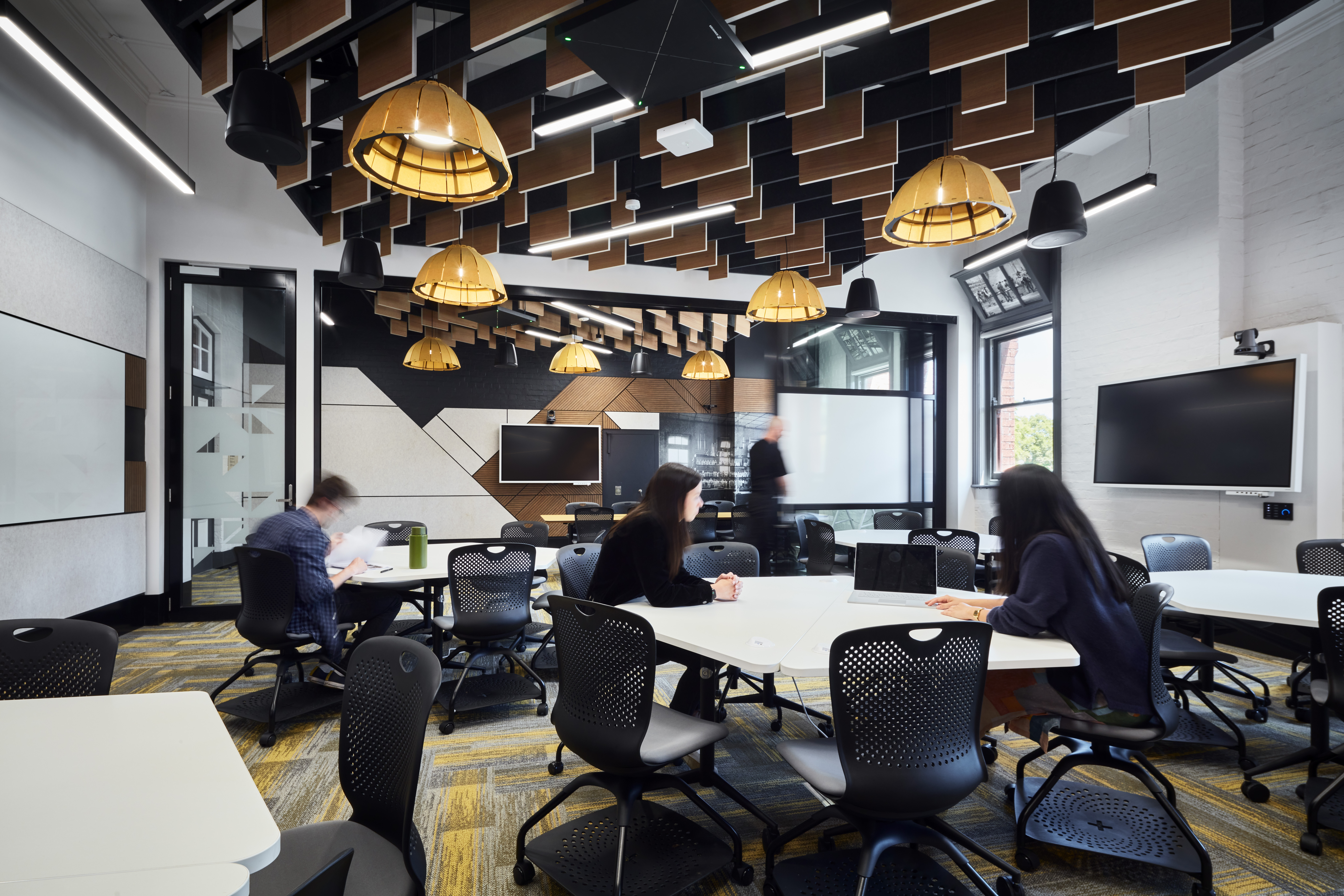 Students sitting in a modern classroom.