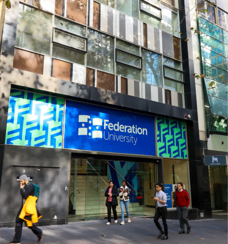 Outside photo of Federation University Melbourne City Campus with people passing on the street.